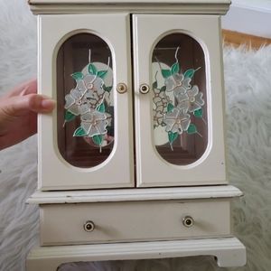 Vintage jewelry storage box with music box